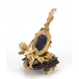 French Empire style gilt bronze and marble desk mirror in the form of a cherub with a mandolin, 30cm