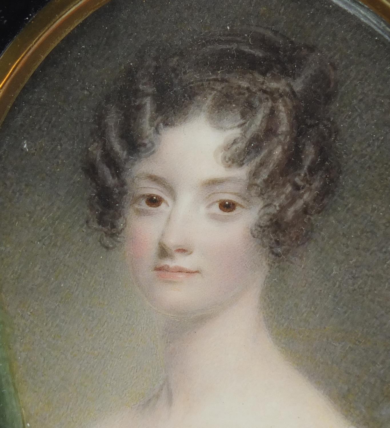 19th century oval hand painted portrait miniature of a young female, housed in an ebonised frame, - Image 4 of 4