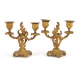 Pair of Rococco gilt metal two branch candlesticks, each 15cm high :For Further Condition Reports