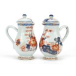 Pair of Chinese porcelain chocolate pots and covers, each hand painted in the Imari palette with