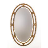 Oval gilt framed bevelled edge mirror, 70cm x 44cm :For Further Condition Reports Please visit Our
