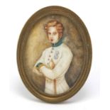Oval hand painted portrait miniature of a young gentleman in military dress, housed in a brass