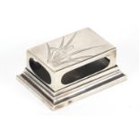 Japanese silver matchbox case engraved with iris on stand, with impressed character marks, 7.5cm
