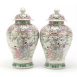 Pair of Chinese porcelain baluster vases and covers, each hand painted in the famille rose palette
