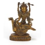 Chino-Tibetan gilt bronze figure of a deity, 25cm high :For Further Condition Reports Please visit