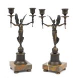 Pair of classical patinated bronze two branch candlesticks raised on square marble bases, each