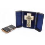 Gilt brass and enamel crucifix with fitted case and a silver mounted prayer book with vellum