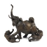 Large patinated bronze study of an elephant and three tigers, 38cm wide :For Further Condition