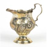 18th Century silver cream jug embossed with flowers, indistinct makers mark, London 1769, 10cm high,