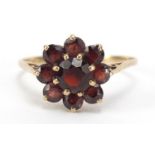 9ct gold garnet flower head ring, size P, 1.9g :For Further Condition Reports Please visit Our