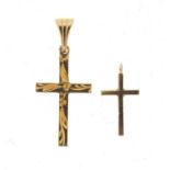 9ct gold cross pendant and a gold plated example, the largest 2.5cm high, 1.2g :For Further