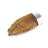 Taxidermy otter paw brooch with unmarked silver mount, engraved Wye Valley 26.8.36, 8cm in length :