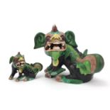 Pair of Chinese famille verte Foo dogs, one with impressed mark, each inscribed Staffs to the