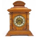 Oak cased mantle clock striking on a gong with Roman numerals, the movement 43.5cm high :For Further