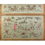 Chinese silk panel embroidered with two figures amongst flowers in a landscape below two foo dogs,