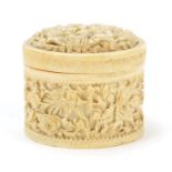 Chinese Canton ivory pot and cover, profusely carved with flowers, 7.5cm high x 8.5cm in diameter :