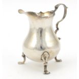George III silver milk jug raised on three feet, IW London 1763, 9.5cm high, 102.0g :For Further