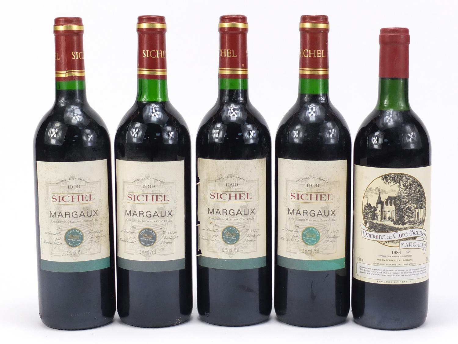 Five bottles of Margaux red wine comprising 1986 Domaine de Cure-Bourse and four bottles of 1999