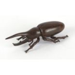 Japanese patinated bronze rhinoceros beetle, impressed marks to the underside, 8.5cm in length :