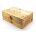 Twelve bottles of 2001 Chateau Tour de Pez Saint-Estephe housed in a sealed crate. :For Further