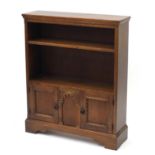 Ipswich oak open bookcase fitted with a pair of cupboard doors to the base, 102cm H x 84cm W x