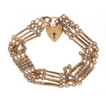 9ct gold four row gate bracelet with love heart shaped padlock, 19.8g :For Further Condition Reports