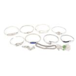 Eleven silver bracelets including some enamelled and some set with semi precious stones, 94.0g :