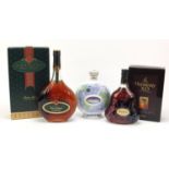 Three bottles of Cognac and Armangac comprising a Hennessey XO, Janneau Grand Armangac and Aurora XO