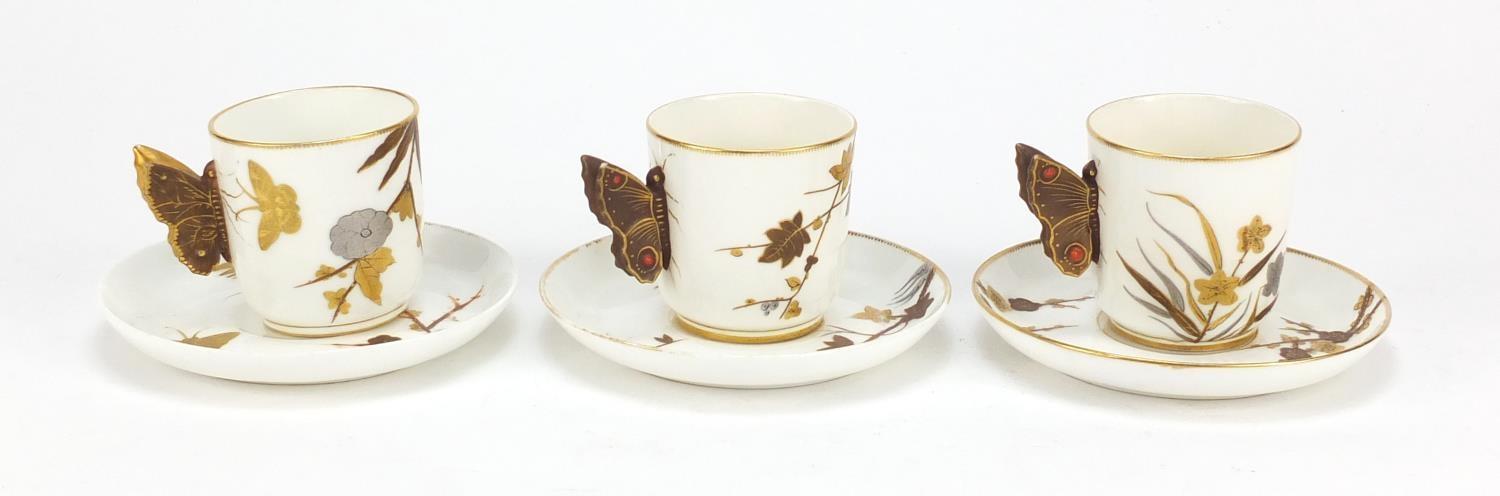 Three aesthetic Worcester coffee cans and saucers with butterfly design handles, each gilded with - Image 3 of 6