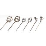 Three pairs of Art Nouveau silver hat pins by Charles Horner, the largest 16.7cm in length :For