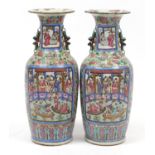 Large pair of Chinese Canton porcelain vases, each hand painted in the famille rose palette with