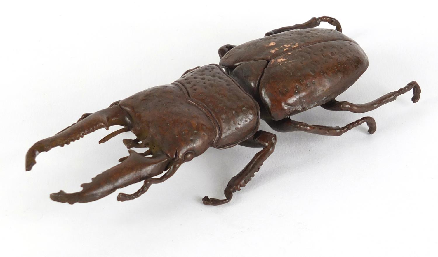 Japanese patinated bronze stag beetle, impressed marks to the underside, 13.5cm in length :For