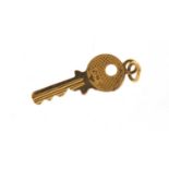 9ct gold key charm, 2cm in length, 0.7g :For Further Condition Reports Please visit Our Website,