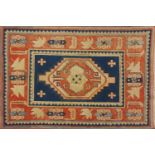 Blue and salmon ground rug, having an all over geometric design, 175cm x 122cm : For Further