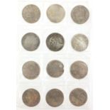 Twelve Chinese silver coloured metal coins : For Further Condition Reports Please visit Our Website,