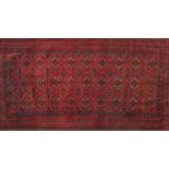 Rectangular Oranda rug having an all over geometric design onto a red ground, 175cm x 96cm : For