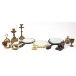 Metalware and objects including brass candlesticks, slave bangles, hand mirrors and bells : For