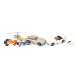 Two Corgi James Bond die cast vehicles and helicopter, comprising Toyota 2000 GT and Aston Martin