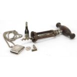 Objects including an antique corkscrew, a silver vesta and a cigar cutter in the form of a