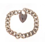 Silver curb link bracelet with love heart shaped padlock, 16cm in length, 55.0g :For Further
