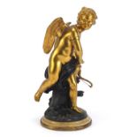 19th century partially gilt bronze figure of Cupid, raised on a marble base, 31cm high :For