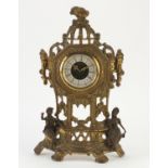 Ornate brass mantel clock mounted with two figures, 36cm high :For Further Condition Reports