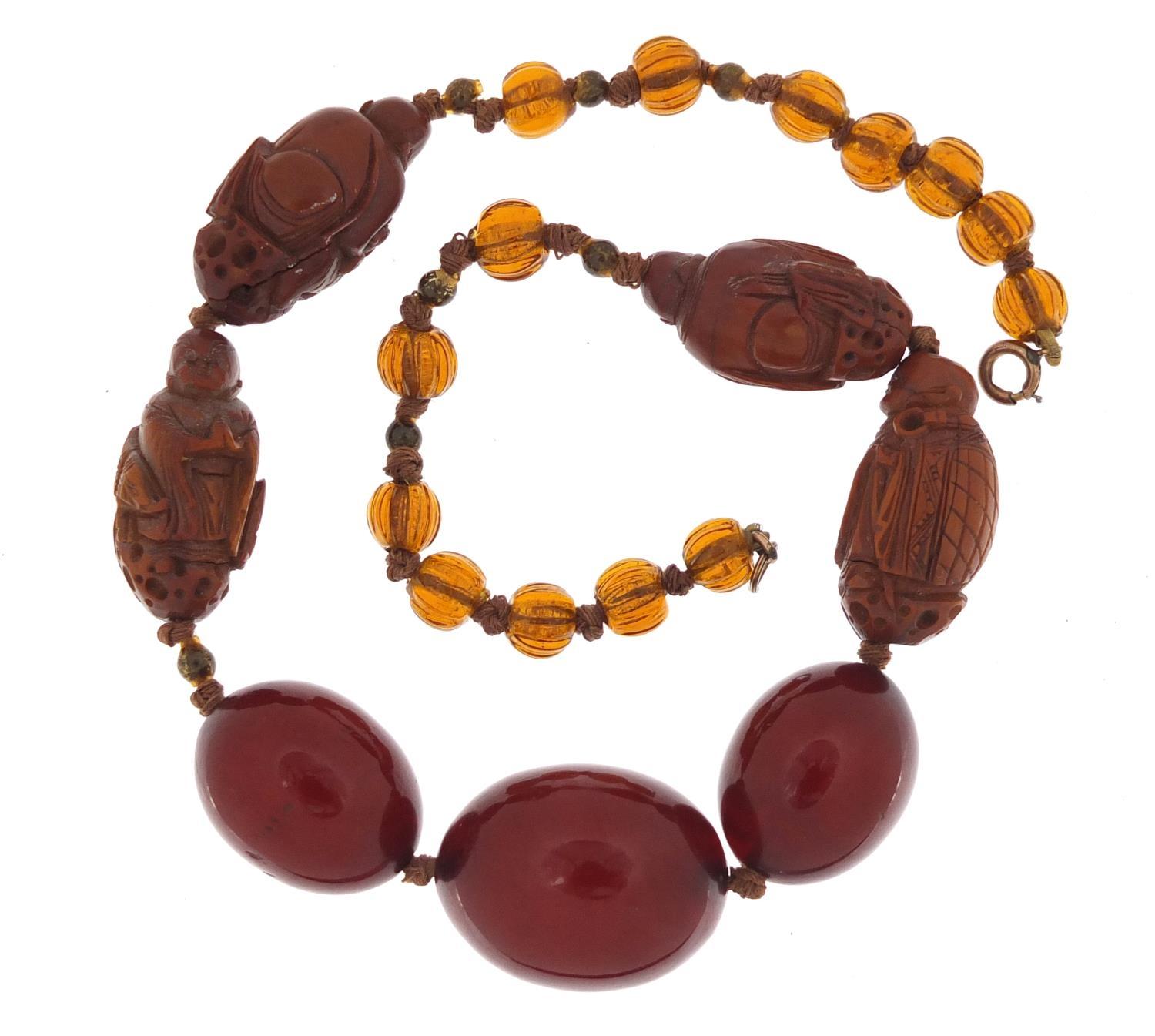 Chinese cherry amber coloured bead and carved coquilla nut necklace, 40cm in length :For Further - Image 4 of 4