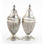 Pair of Victorian silver demi fluted casters, indistinct maker's mark, Birmingham 1901, 9cm high,