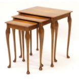Nest of three walnut occasional tables :For Further Condition Reports Please Visit Our Website,