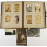 Victorian black and white cabinet cards arranged in a leather album :For Further Condition Reports