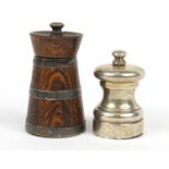 Silver pepper mill and an oak silver banded example, London and Birmingham hallmarks, the largest
