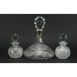 Silver mounted cut glass ship's decanter and a pair of hob nail cut decanters, the largest 27cm high