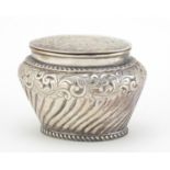 Victorian silver caddy with hinged lid and embossed with flowers, indistinct maker's mark,