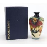 Moorcroft pottery vase with box, hand painted with stylised flowers, 16cm high :For Further